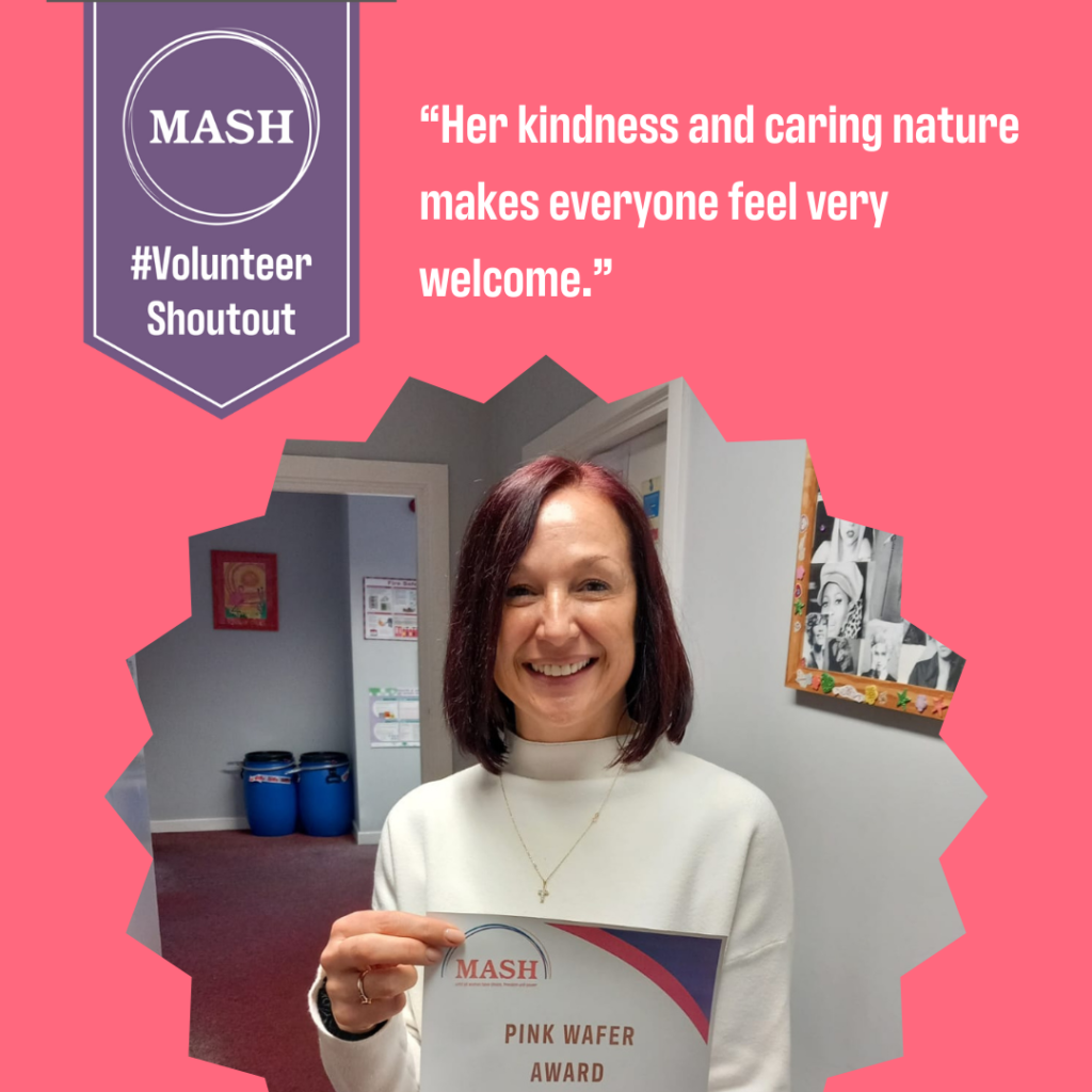 Volunteer holding certificate with caption "Her kindness and caring nature makes everyone feel welcome."