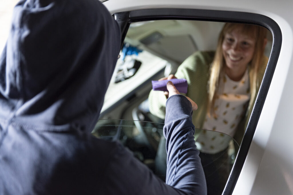 Worker handing out condoms from the van